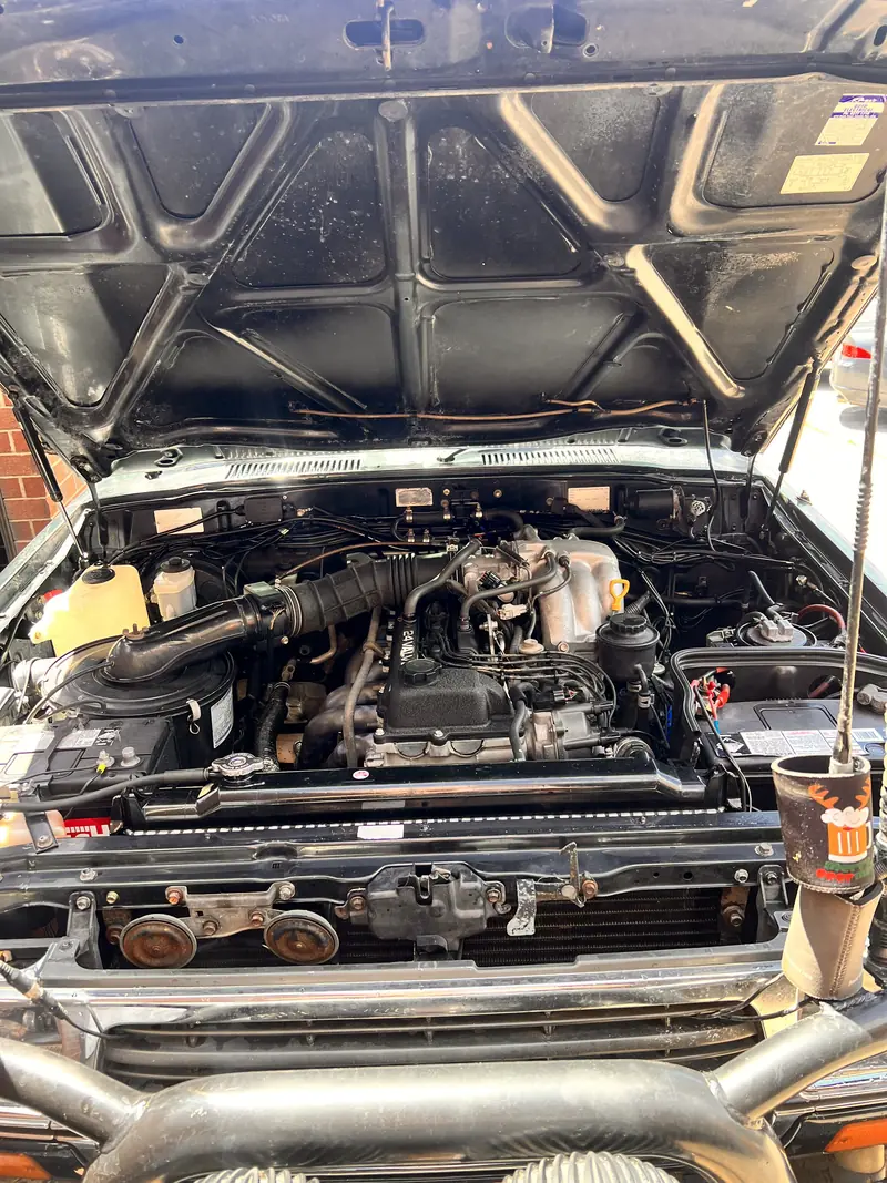 80 Series LandCruiser engine bay with the bonnet open